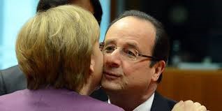 Hollande and Merkel greeting hello